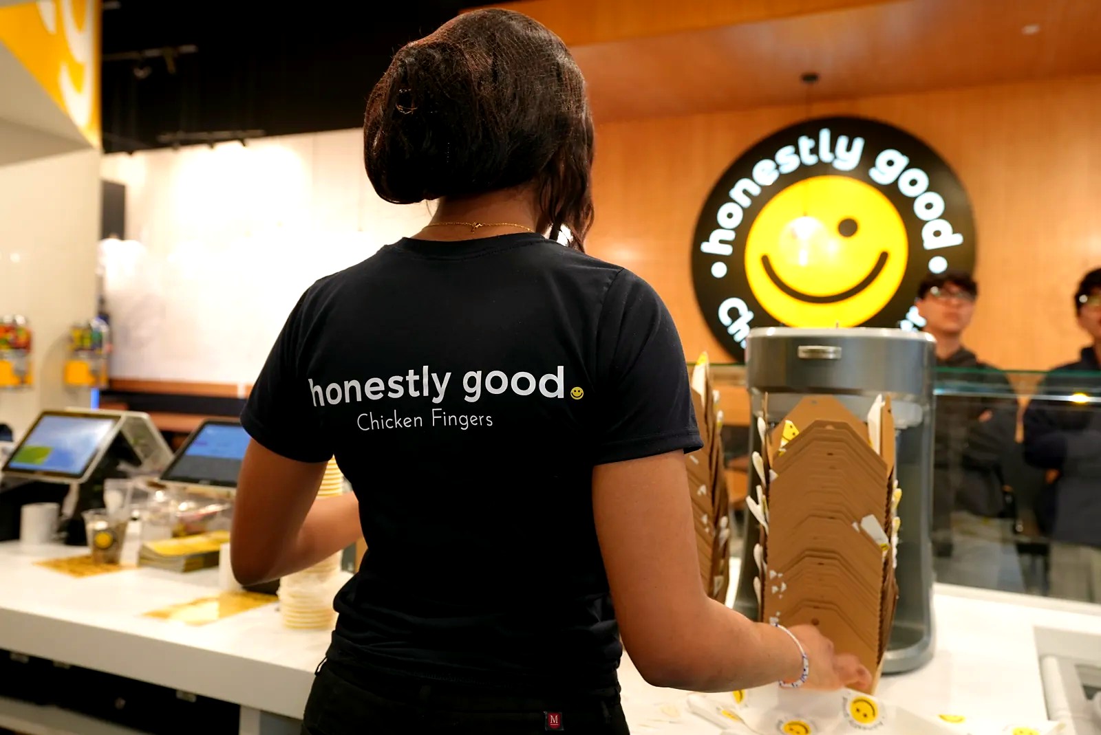 An Honestly Good team member serving at the counter